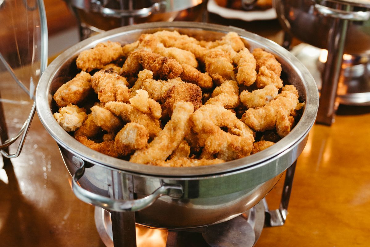 Hot food held in a chafing dish, which must stay at 140F or above during service