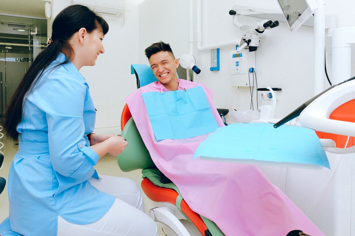 Relaxed patient sitting in a dental chair during a consultation appointment