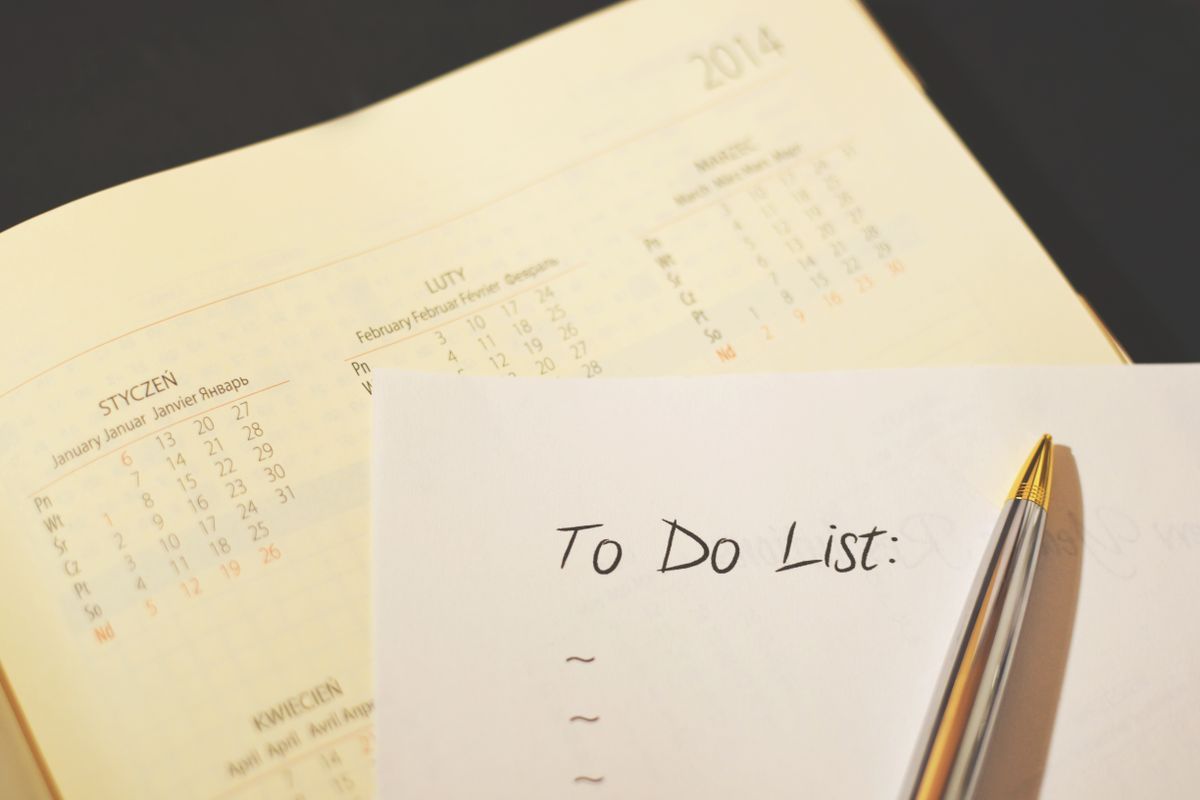 Checklist and pen used to track which credit disputes have been sent and answered