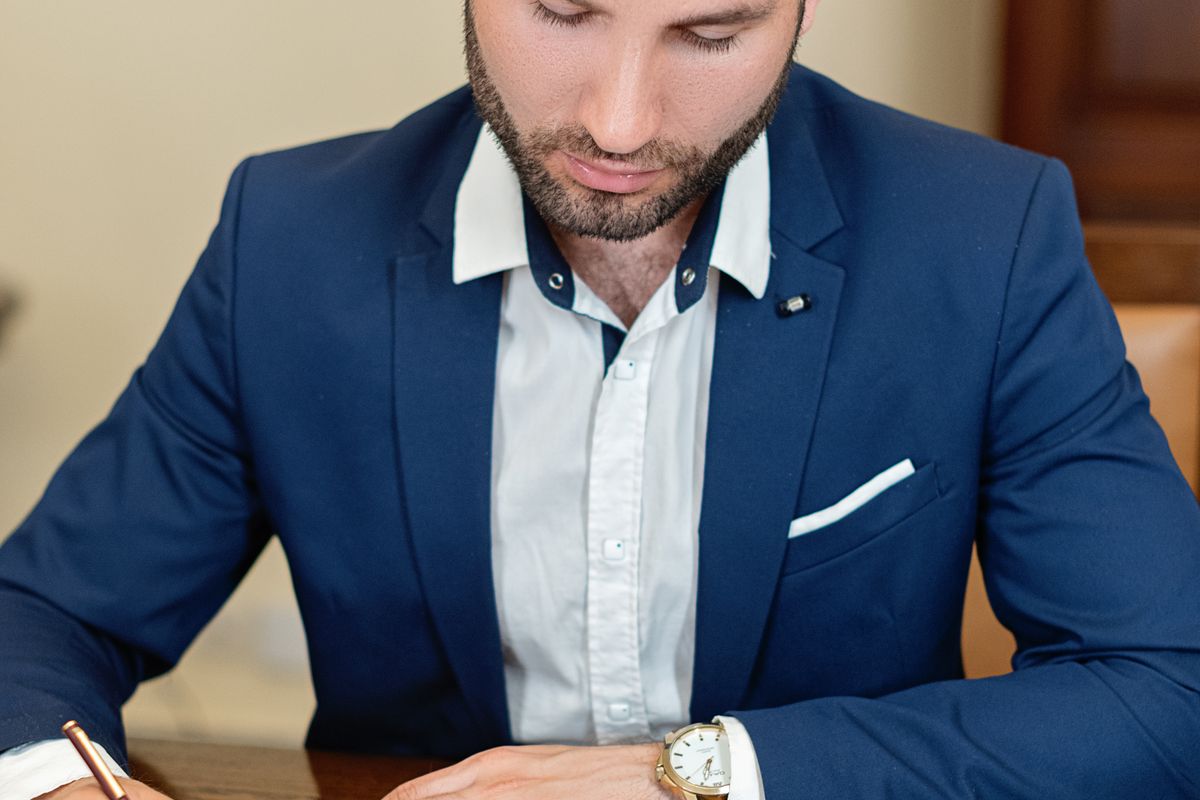 Reading the written terms of a service agreement closely before signing