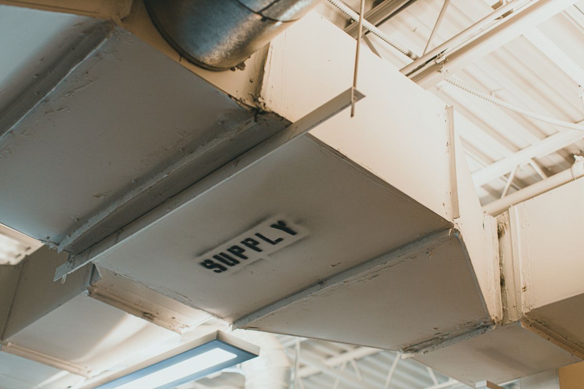 Close-up of a metal supply air duct forming part of a building's HVAC system