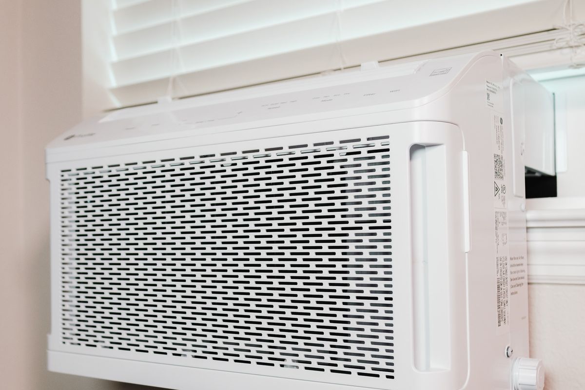 Wall-mounted air conditioning unit installed in a residential room