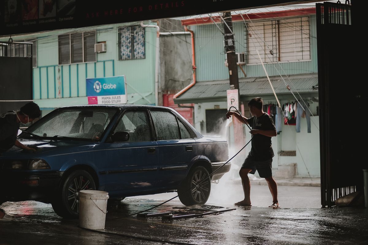 Washing a car with a hose, where driveway runoff reaches storm drains untreated