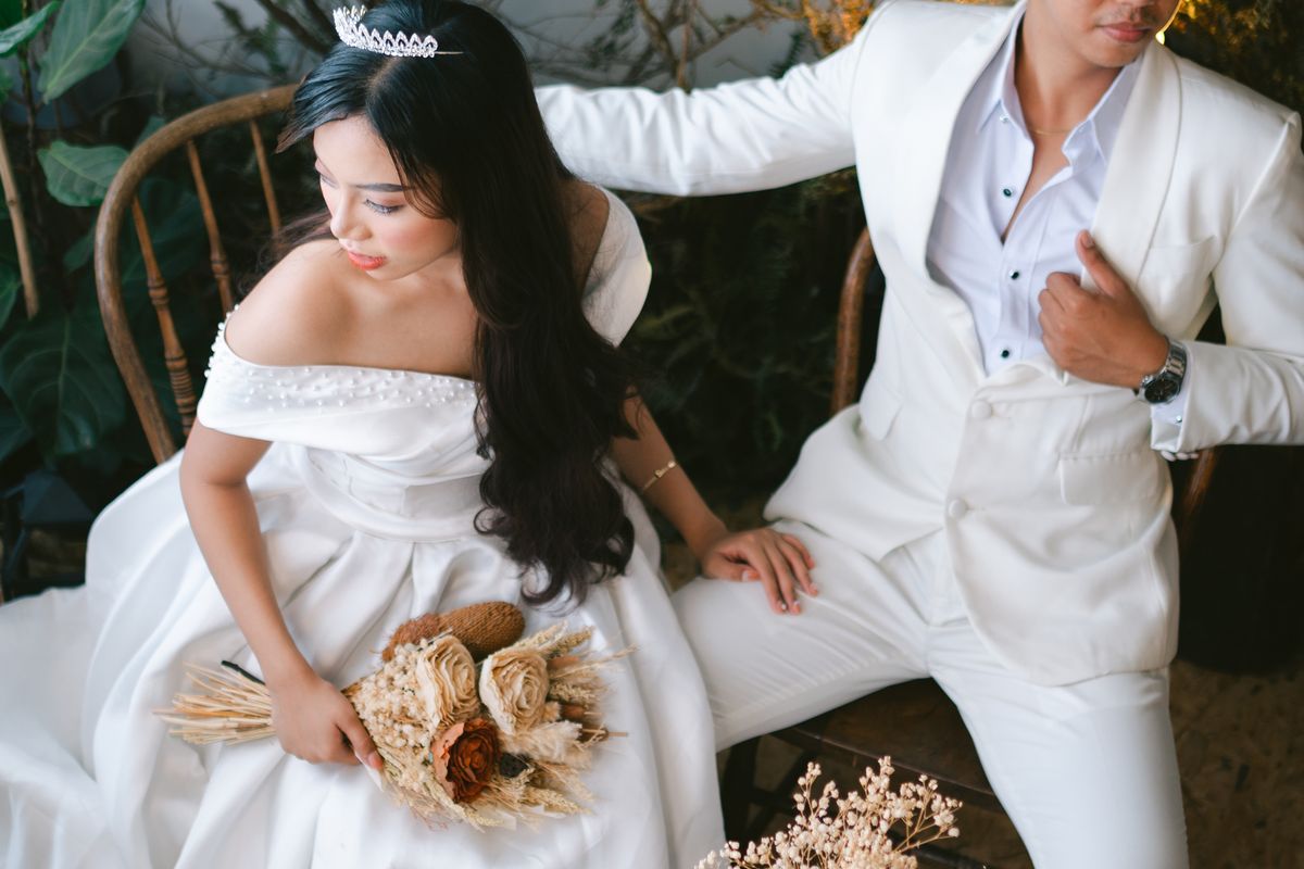A photographer covering a couple on their wedding day