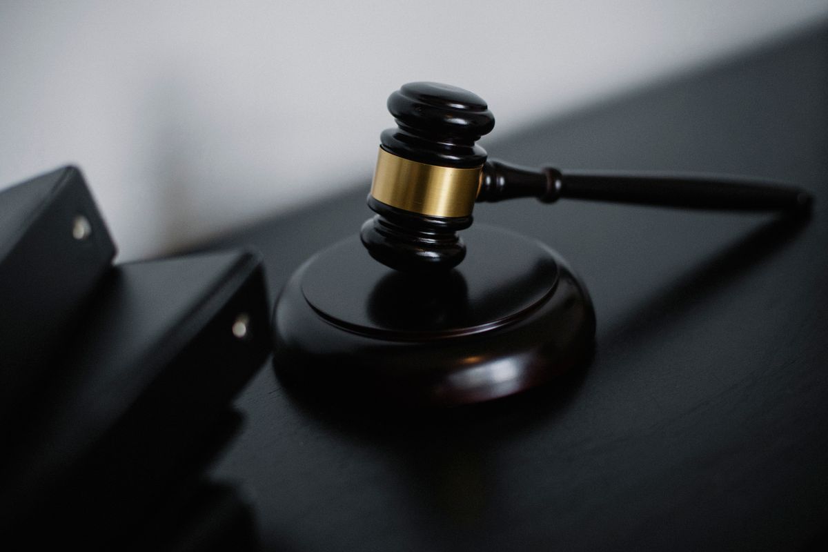 Close-up of a wooden gavel, representing a case that proceeds to litigation