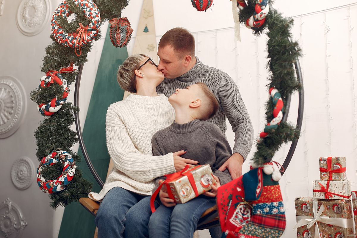 Couple exchanging wrapped Christmas gifts
