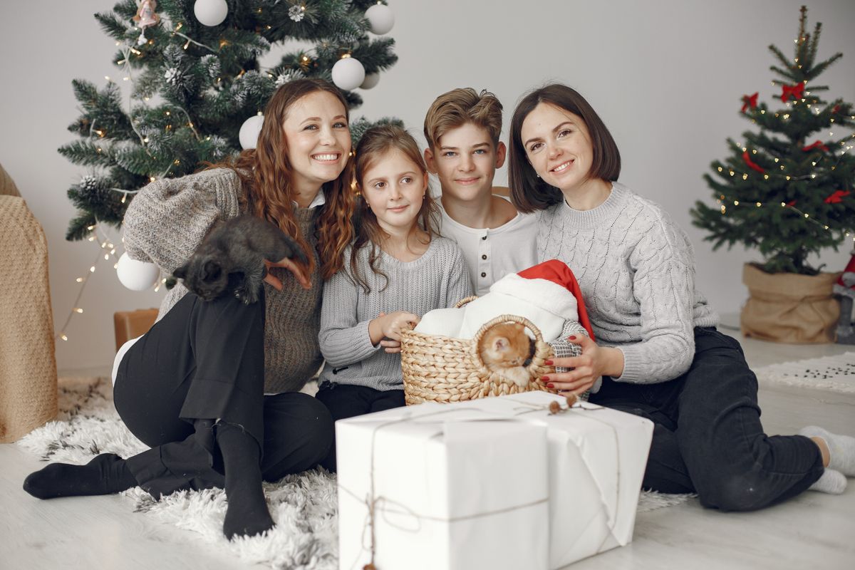 Handing over a wrapped Christmas gift