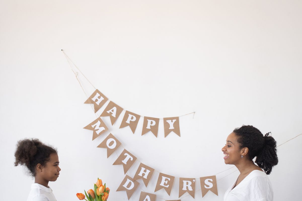 Children giving their mother a Mother's Day gift